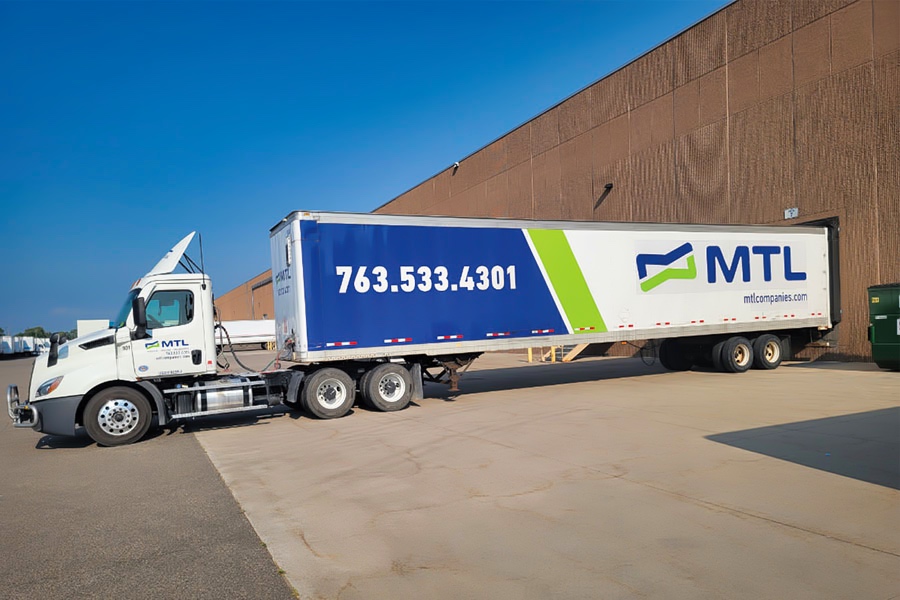 MTL Companies tractor and branded trailer at a warehouse